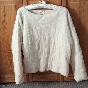 Woman’s quilted pullover top